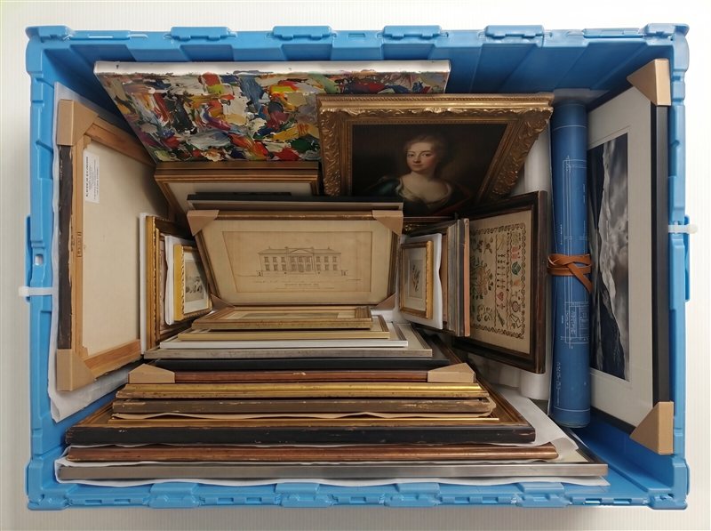 Paintings and frames stored in a large Fort Lox box